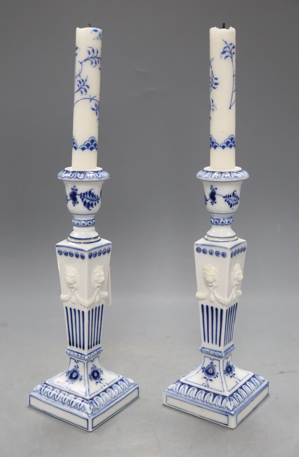 A pair of Royal Copenhagen blue and white candlesticks, height 23cm